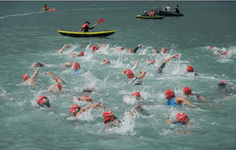 Safety boats on patrol in one of Orange Room’s open water swim events in Singapore. 